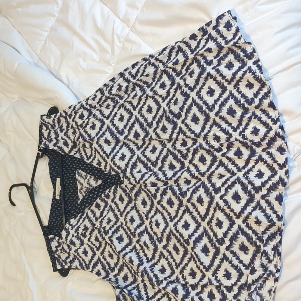 Navy and white sleeveless blouse.